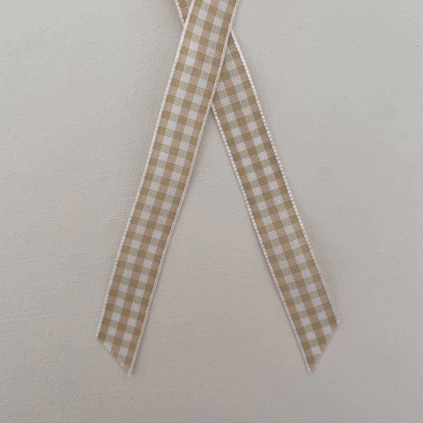 1 1/4" brass sleigh bell ornament on gingham ribbon: Tan/White