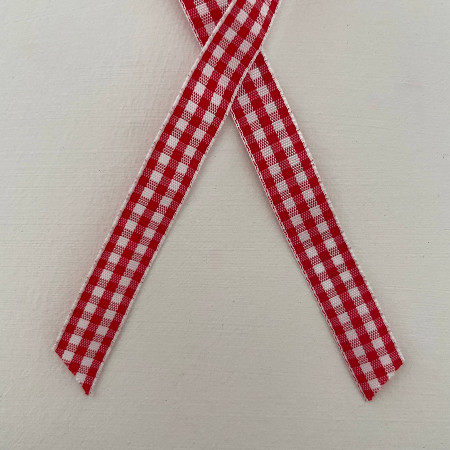 1 1/4" brass sleigh bell ornament on gingham ribbon: Red/White